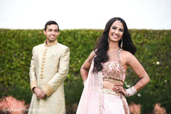 Adorable indian couple posing with their sangeet outfits. Adorable indian couple posing with their sangeet outfits.
