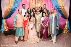 Ravishing indian bride and groom with family members capture. Ravishing indian bride and groom with family members capture.