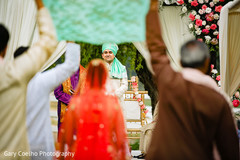 Joyful Indian groom looking at Indian bri Joyful Indian groom looking at Indian bri