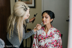 Indian bride getting her makeup done Indian bride getting her makeup done