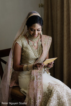 Sweet indian bride reading groom's card Sweet indian bride reading groom's card