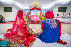 Tender moment between the Indian couple staring at the Mandap Tender moment between the Indian couple staring at the Mandap
