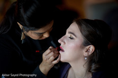 Makeup artist assists the beautiful maharani prior to the wedding. Makeup artist assists the beautiful maharani prior to the wedding.