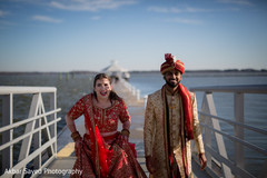 Indian bride and groom stand next to each other during the session. Indian bride and groom stand next to each other during the session.