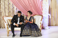 Indian bride and groom sit in the Jhula for pictures. Indian bride and groom sit in the Jhula for pictures.