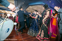 Fun capture of guests dancing with the Indian bridesmaids and the maharani. Fun capture of guests dancing with the Indian bridesmaids and the maharani.