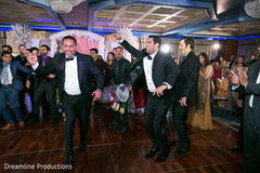 Indian groom dances to the rhythm of the dhol. Indian groom dances to the rhythm of the dhol.