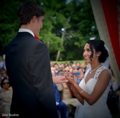 Dreamy Indian bride putting ring to groom at their Christian wedding. Dreamy Indian bride putting ring to groom at their Christian wedding.