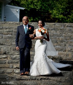 Indian bride walking down the aisle with her father. Indian bride walking down the aisle with her father.