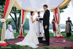 Lovely Indian bride and groom at their wedding bows. Lovely Indian bride and groom at their wedding bows.