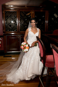 Glamorous Indian bride on her white wedding dress. Glamorous Indian bride on her white wedding dress.