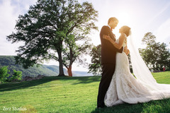 Indian bride and groom posing outdoors. Indian bride and groom posing outdoors.