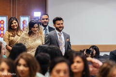 The nervous Indian couple make their entrance to the ceremony rituals.