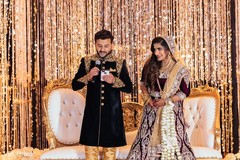 The Indian groom delivers a speech as the beautiful maharani stares.