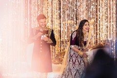 Indian couple has a laugh as the speech goes.