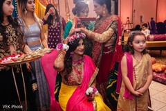 Indian bride receives help from her special guests.