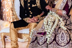Stunning capture of Indian bride and groom holding hands. Stunning capture of Indian bride and groom holding hands.