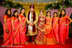 Lovely indian couple posing with bridal party Lovely indian couple posing with bridal party