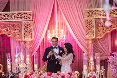 Indian bride and groom having cheers at reception. Indian bride and groom having cheers at reception.