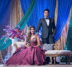 Glamorous Indian bride and groom on their wedding reception outfits. Glamorous Indian bride and groom on their wedding reception outfits.