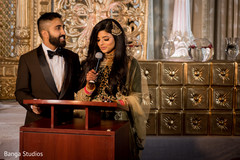 Indian bride and groom's reception speech moment capture. Indian bride and groom's reception speech moment capture.