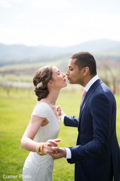 Indian couple have a tender moment under the sky.