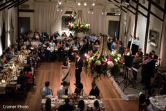 Guests observe as the Indian groom and his mother dance. Guests observe as the Indian groom and his mother dance.