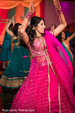 Indian bride dancing during sangeet Indian bride dancing during sangeet