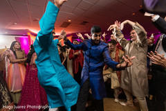 Indian dancing groom during sangeet Indian dancing groom during sangeet