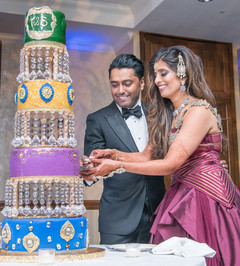 Indian wedding cutting the cake scene. Indian wedding cutting the cake scene.