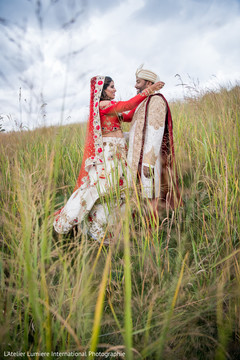 Gorgeous Indian bride and groom in their ceremony traditional outfits. Gorgeous Indian bride and groom in their ceremony traditional outfits.