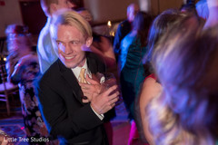Happy indian wedding guest laughing Happy indian wedding guest laughing