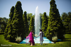The Indian couple hold hands as the ceremony comes closer.