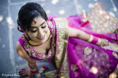Gorgeous maharani wearing the tikka and the sari smiles for the photo shoot. Gorgeous maharani wearing the tikka and the sari smiles for the photo shoot.