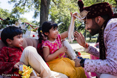 Kid touches the Indian groom's wedding accessories Kid touches the Indian groom's wedding accessories