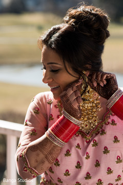 Indian bride getting her earrings on capture. Indian bride getting her earrings on capture.