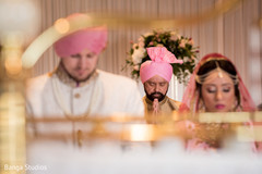 Sweet Indian couple at their wedding ceremony capture. Sweet Indian couple at their wedding ceremony capture.