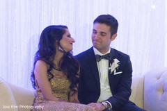 Indian newlyweds stare at each other tenderly during the reception Indian newlyweds stare at each other tenderly during the reception