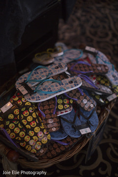 Fun capture of a basket of sandals at the Indian wedding reception