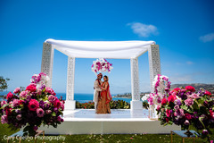 Joyful Indian bride and groom walking outdoors capture. Joyful Indian bride and groom walking outdoors capture.