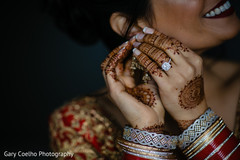 Dazzling Indian bride putting her earrings on. Dazzling Indian bride putting her earrings on.