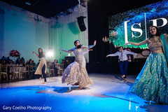 Indian bride with bridesmaids and groomsmen showing some dance moves. Indian bride with bridesmaids and groomsmen showing some dance moves.