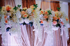 Stunning stage decoration with roses and white flowers decor. Stunning stage decoration with roses and white flowers decor.