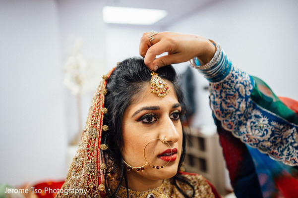 Indian bride getting her tikka on.