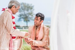 Indian groom getting ritual items at wedding ceremony capture. Indian groom getting ritual items at wedding ceremony capture.