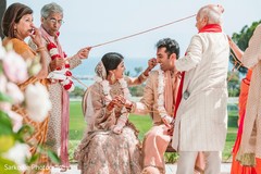 Indian bride and groom getting the rope at wedding ceremony ritual. Indian bride and groom getting the rope at wedding ceremony ritual.