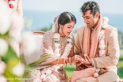 Sweet Indian couple exchanging rings. Sweet Indian couple exchanging rings.