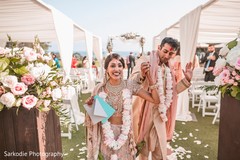 So in love Indian couple walking hand in hand out from wedding ceremony. So in love Indian couple walking hand in hand out from wedding ceremony.