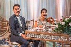 Cheerful Indian bride and groom at their wedding reception. Cheerful Indian bride and groom at their wedding reception.