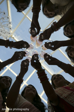 Stunning Indian bridesmaids make a toast prior to the wedding Stunning Indian bridesmaids make a toast prior to the wedding